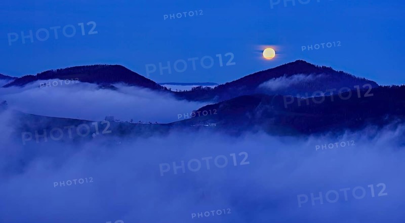 View from the Gisliflue of the Jurassic foothills covered in fog from the left, Asperstrihen, Strihen, in the light of the full moon, Talheim, Canton, Aargau, Switzerland
