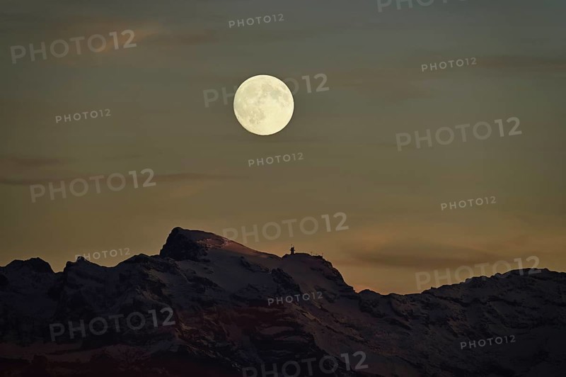 View of snow-covered Titlis from Horben in the light of a full moon, Beinwil-Freiamt, Canton, Aargau, Switzerland