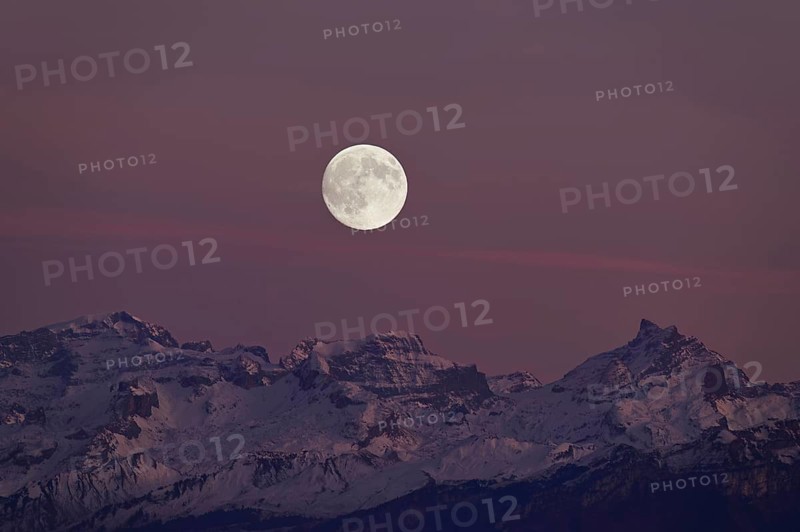 View from Horben of the snow-covered mountains from the left TÃ¶di, Chammliberg, SchÃ¤rhorn, in the light of the full moon, Beinwil-Freiamt, Canton, Aargau, Switzerland