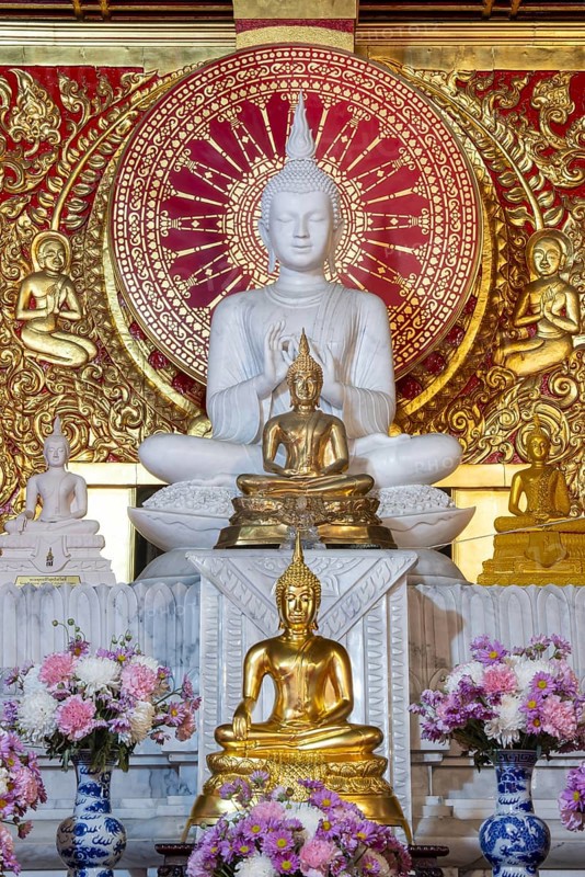 Various Buddha statues, Bhumispara mudra, Buddha Gautama at the moment of enlightenment, as well as meditating and teaching, Wat Sitthawararam, Bangkok, Thailand