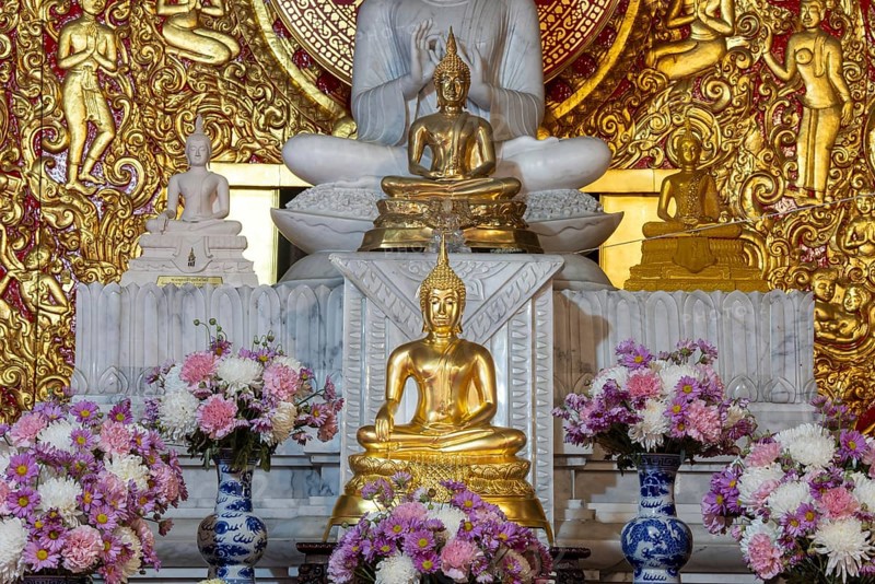 Various Buddha statues, Bhumispara mudra, Buddha Gautama at the moment of enlightenment, as well as meditating and teaching, Wat Sitthawararam, Bangkok, Thailand
