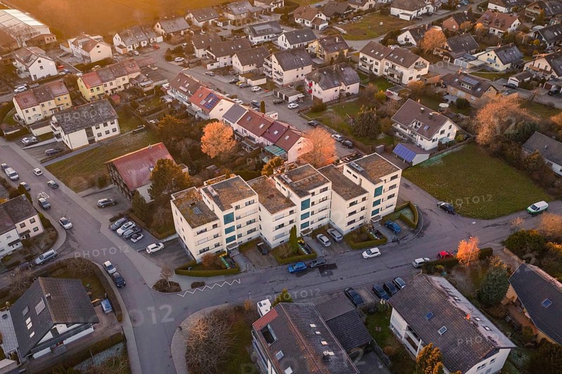View of apartment buildings in a suburban neighborhood with parked cars, Althengstett, Calw district, Germany