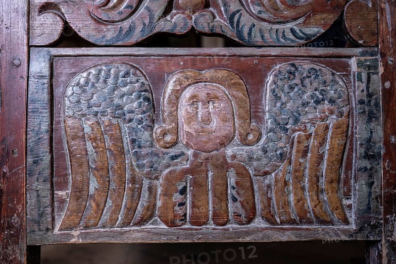 Angel, wooden relief, cradle, BjÃ¸rnstad, farm from VÃ¥gÃ¥, Maihaugen open-air museum with houses and objects from farms in Gudbrandsdal, Lillehammer on Lake MjÃ¸sa, Innlandet Municipality, Norway