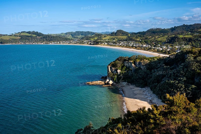 Landscape with sea and sandy beach in New Zealand. View of Lonely Bay and Cooks Beach from Shakespeare Cliff. Cooks Beach, Coromandel Peninsula, Waikato, New Zealand