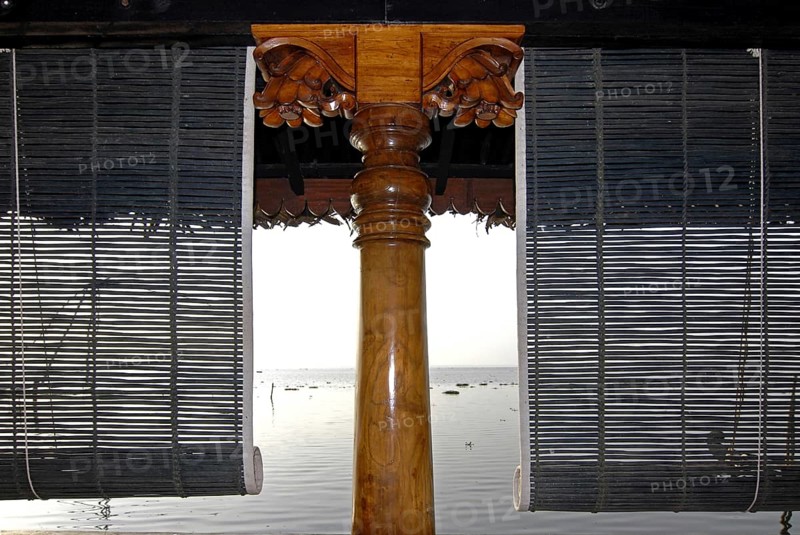 Close-up view of bamboo blinds and artfully turned wooden post, Heritage Hotel Privacy, Vembanad Lake, Kerala, India