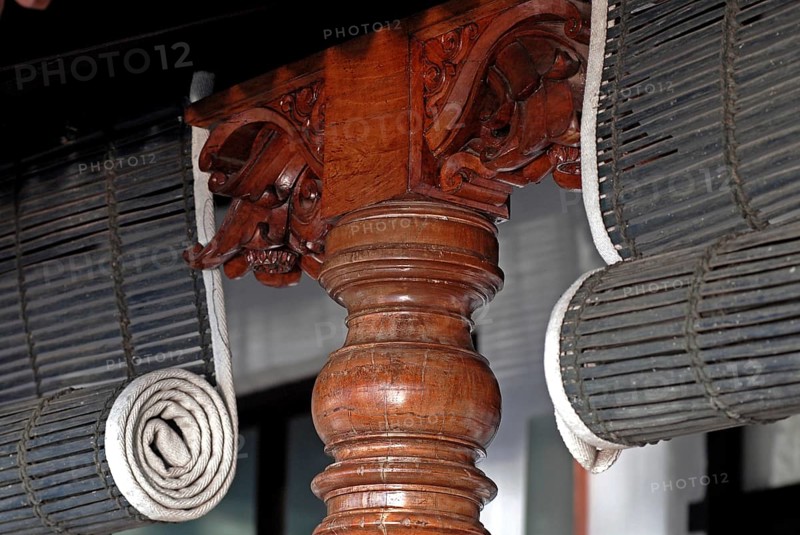 Close-up view of rolled bamboo blinds and artfully turned wooden post, Heritage Hotel Privacy, Vembanad Lake, Kerala, India