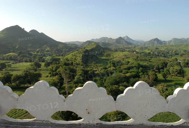 Hilly, green landscape of Aravalli Mountains in monsoon, view from Palace Hotel Devigarh, Delwara village near Udaipur, Rajasthan, India