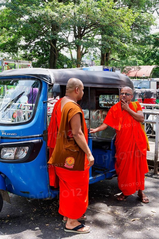 Buddhist monks talking near a tuk-tuk, Kandy, Sri Lanka