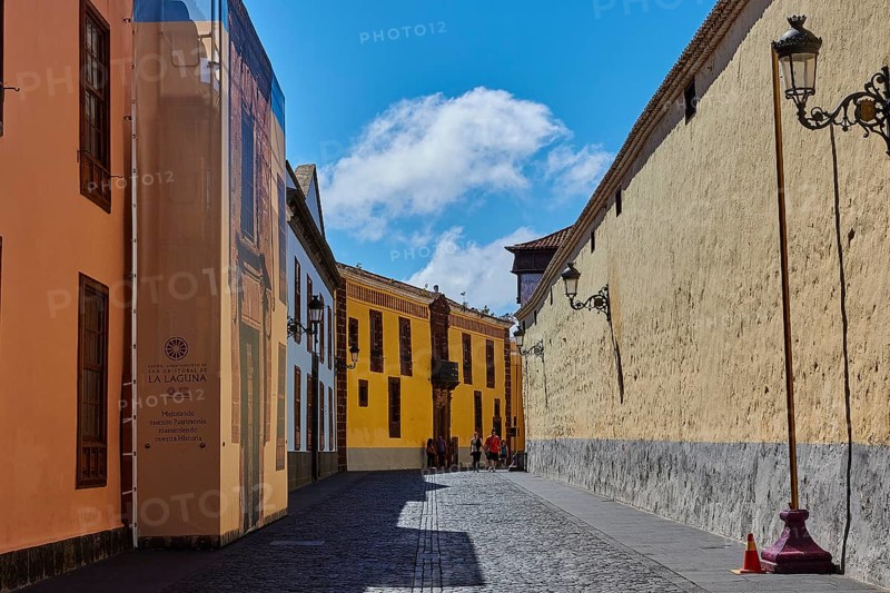 Painted street scene with historic buildings under blue sky, UNESCO World Heritage Old Town of San Crstobal de La Laguna, La Laguna, Tenerife, Canary Islands, Spain
