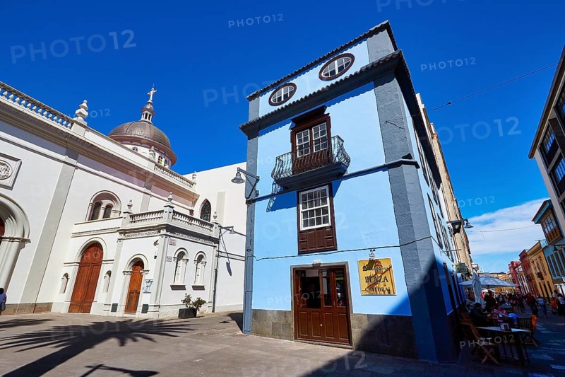 Blue building next to a historic domed church in the shadow of another building, UNESCO World Heritage Old Town of San Crstobal de La Laguna, La Laguna, Tenerife, Canary Islands, Spain