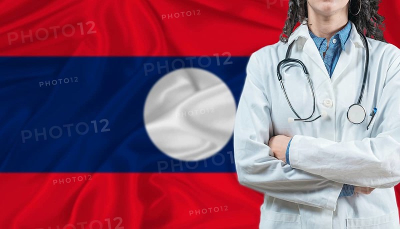 Medical professional on Laos flag. Healthcare and wellness in Laos, Concept