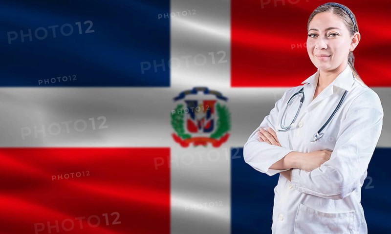Female doctor on Dominican Republic flag. Doctor with crossed arms on Dominican Republic flag. Dominican Republic health and care concept