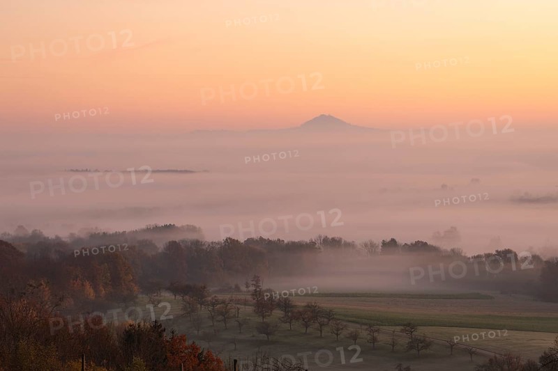 Hohenstaufen in the golden morning light, Aichelberg. Spectacular dawn over the foggy foothills of Alb