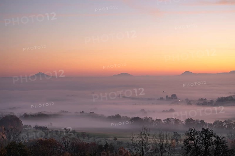 Three Kaiserberge mountains in golden morning light, Hohenstaufen, Aichelberg. Spectacular dawn over the foggy foothills of Baden-WÃ¼rttemberg