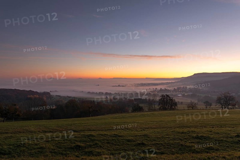 Three Kaiserberge mountains in golden morning light, Hohenstaufen, Aichelberg, spectacular dawn over the foggy foothills of Baden-WÃ¼rttemberg. Bad Boll, EckwÃ¤lden, DÃ¼rnau in the district Göppingen, Baden-WÃ¼rttemberg, Germany