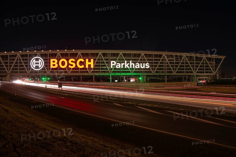 Night view of the A8 with traces of light at the P20 Messe car park, Airport, Stuttgart Germany