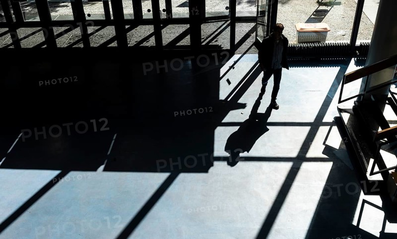 Foyer in a building of the Technical University of Berlin, light and shadow from people at the MarchstraÃŸe exit, Berlin, Germany