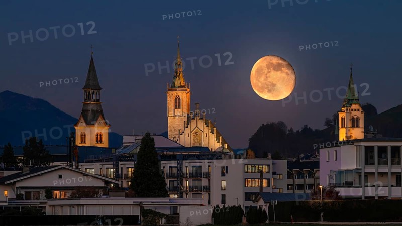 Hospital Church, Parish Church and New Bell Tower, just after full moon, Schwaz, Tyrol, Austria