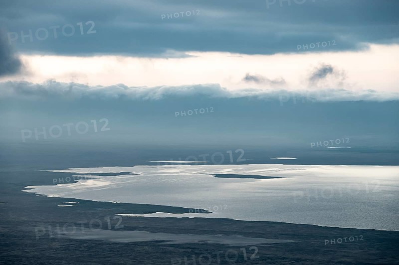View of savanna landscape and Magadi Lake with clouds, view of Ngorongoro Crater, Ngorongoro Conservation Area, Tanzania