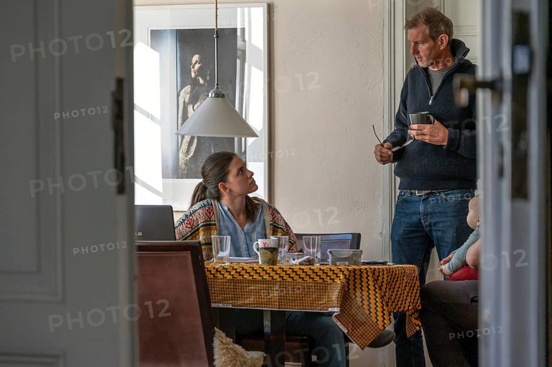 Home office, father and daughter working at the breakfast table, grandchild on the right, Mecklenburg-Western Pomerania, Germany