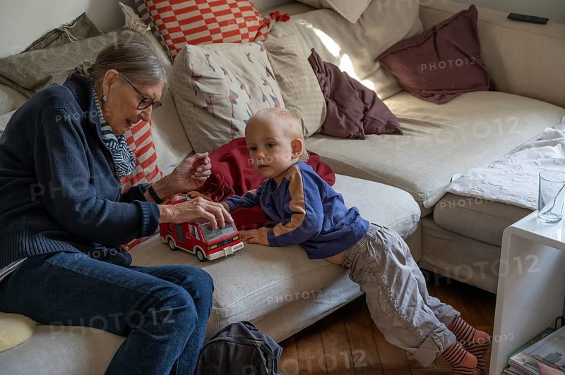 Great-grandmother playing with her great-grandson, two years old, Othenstorf, Mecklenburg-Western Pomerania, Germany