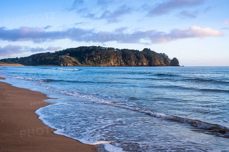 Landscape with sea and sandy beach in New Zealand. Hot Water Beach, Coromandel Peninsula, Waikato, New Zealand
