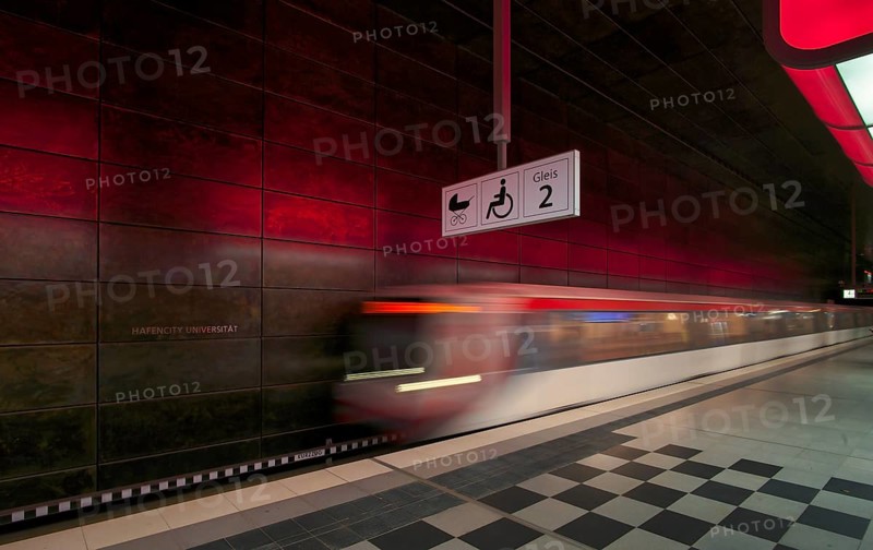 HafenCity University underground station, illuminated in color, red, underground train, movement effect, U4, empty, platform, stop, train station, subway, sign, boarding area wheelchair user, stroller, public transport, HVV, Hamburger Verkehrsverbund, Hochbahn, public transport, Free and Hanseatic City of Hamburg, Germany
