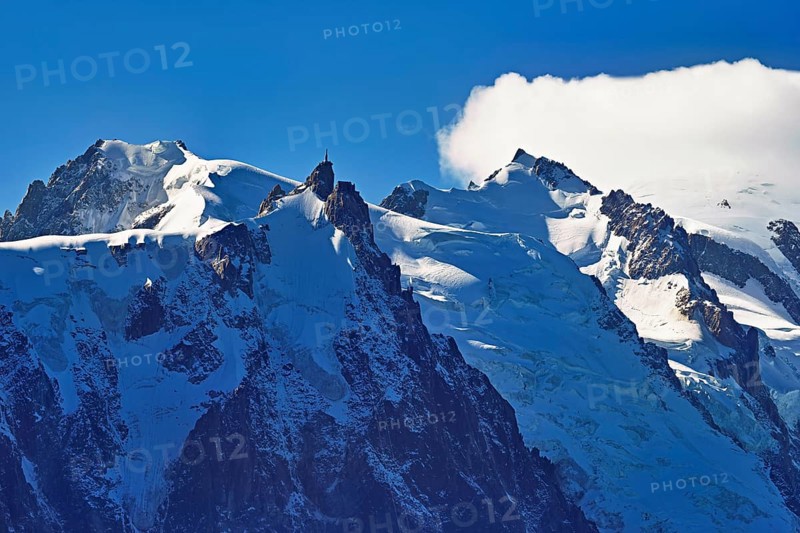 From left snow-covered Mont Blanc du Tacul, Aiguille du Midi, Mont-Blanc in the clouds, Chamonix-Mont-Blanc, Haute-Savoie, France