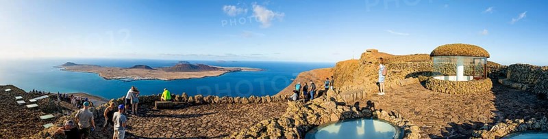 Stairway and tourists on the viewing platform at the Mirador del RÃ­o viewpoint, in the evening light, designed by artist César Manrique, Lanzarote, Canary Islands, Spain