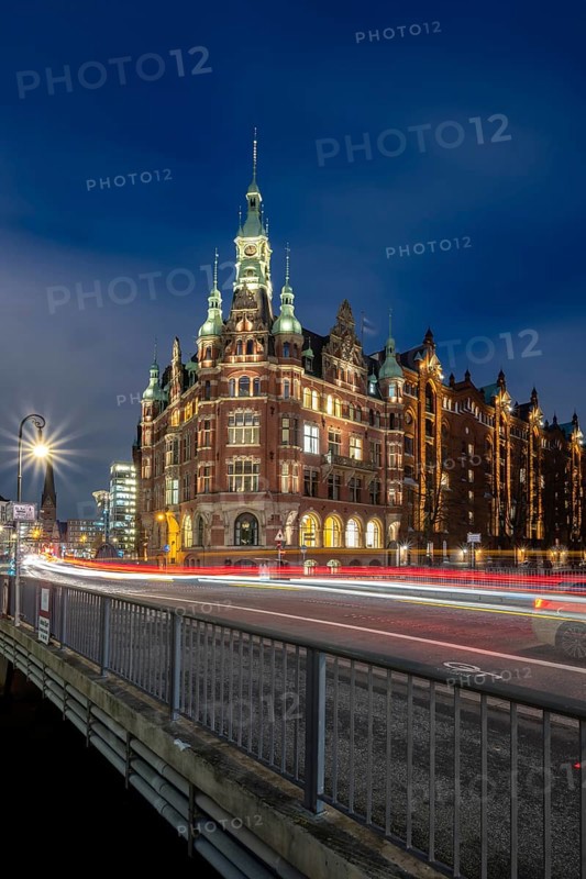 Speicherstadtrathaus am St. Annenfleet in the Speicherstadt Hamburg during blue hour with traces of vehicles in the foreground, Hamburg, Germany