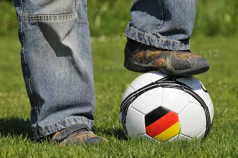 A boy's foot on a football, Germany