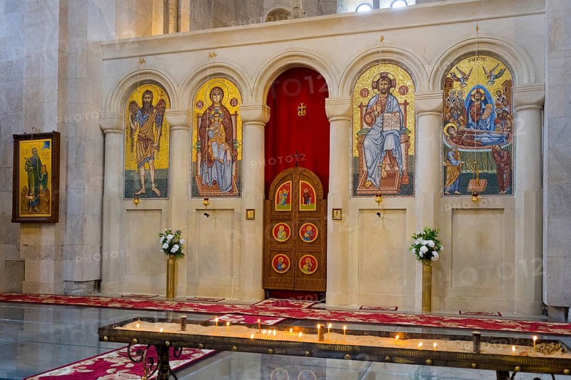A magnificent church interior with mosaics and icons, candles standing in front of a decorated altar, Bagrati Cathedral, Church of the Dormition of the Most Holy Mother of God, UNESCO World Heritage Site, Kutaisi, Imereti Region, Georgia