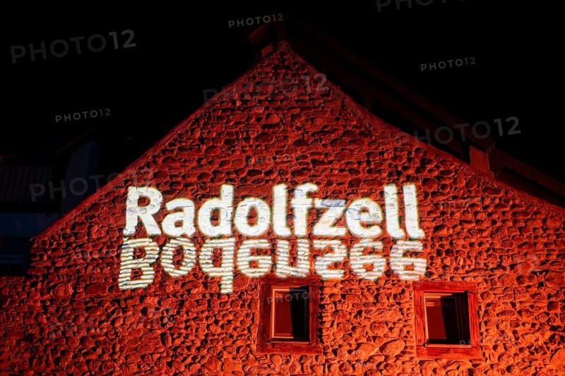 Projected lettering Radolfzell and Lake Constance, official logo of the city of Radolfzell on Lake Constance on a medieval stone house and city wall, as part of the Radolfzell Lichtblicke event and art campaign, supported by the Ministry of Labour, Economy and Tourism Baden-WÃ¼rttemberg, Konstanz district, Baden-WÃ¼rttemberg, Germany