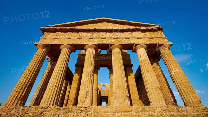 Temple of Concordia, imposing ancient temple with classical columns against a clear sky, Valley of the Temples, Valle dei Templi, Archaeological Site, UNESCO World Heritage Site, Agrigento, Sicily, Italy