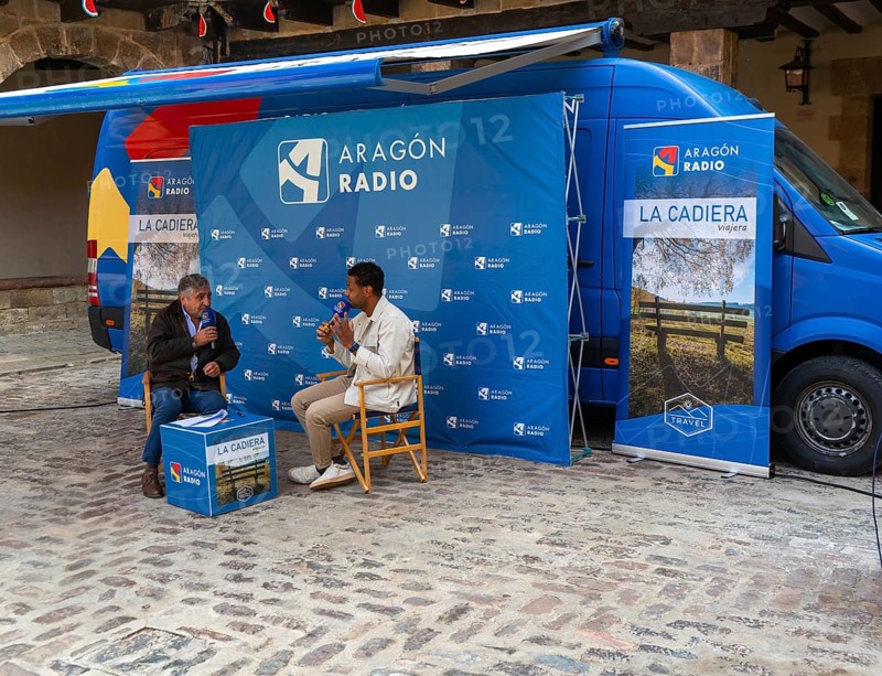 Aragon Radio outside broadcast interview for La Cadiera cultural programme, village of AlbarracÃ­n, Teruel province, Aragon, Spain