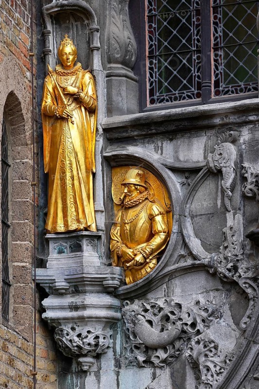 Golden figures on the faÃ§ade of the St. Ivo Chapel at the Basilica of the Holy Blood, Castle Square in the historic old town, Bruges, UNESCO World Heritage Site, Flanders, Belgium