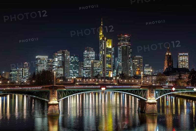 The lights of Frankfurt's banking skyline glow in the evening, Frankfurt am Main, Hesse, Germany