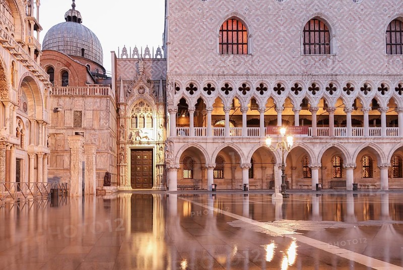 Before sunrise, Doge's Palace and Porta della Carta, during Aqcua Alta, Venice, Italy