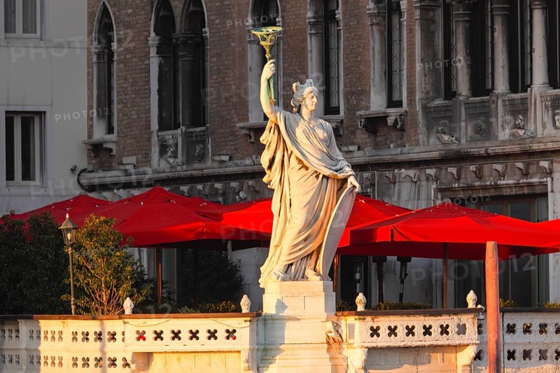 Woman wearing a skewer on the terrace of the Hotel farmer, Palazzo am Canal Grande Venice Italy