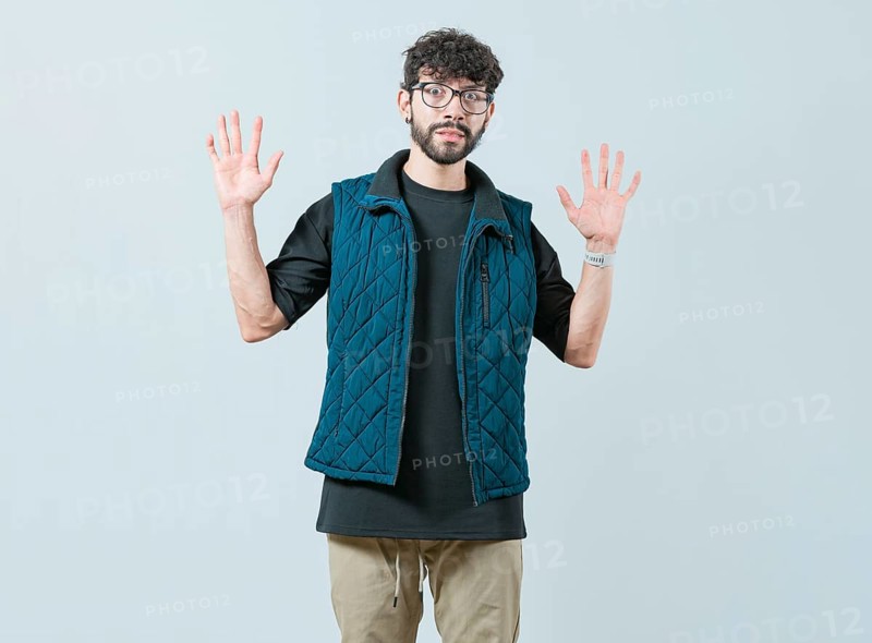 Person scared surprised with raised hands. Scared male with raised hands isolated