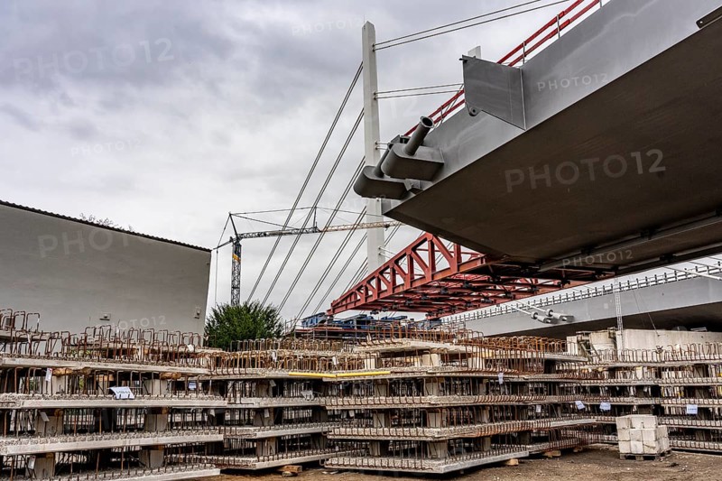 Storage space for building materials at the A40 Neuenkamp bridge, in Duisburg-Homberg, pillars and cables of the new motorway bridge across the Rhine near Duisburg, construction phase of the 2nd bridge structure, North Rhine-Westphalia, Germany