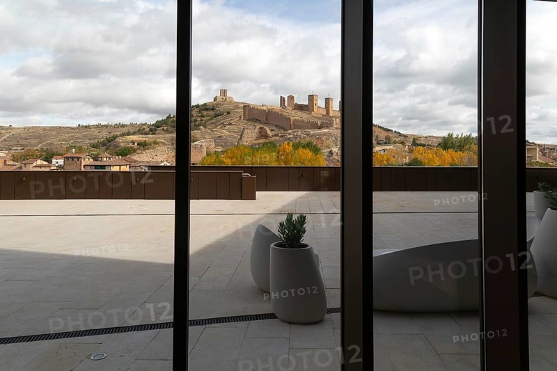 View of castle through glass windows of new Parador de Molina de AragÃ³n, Guadalajara province, Castile-La Mancha, Spain