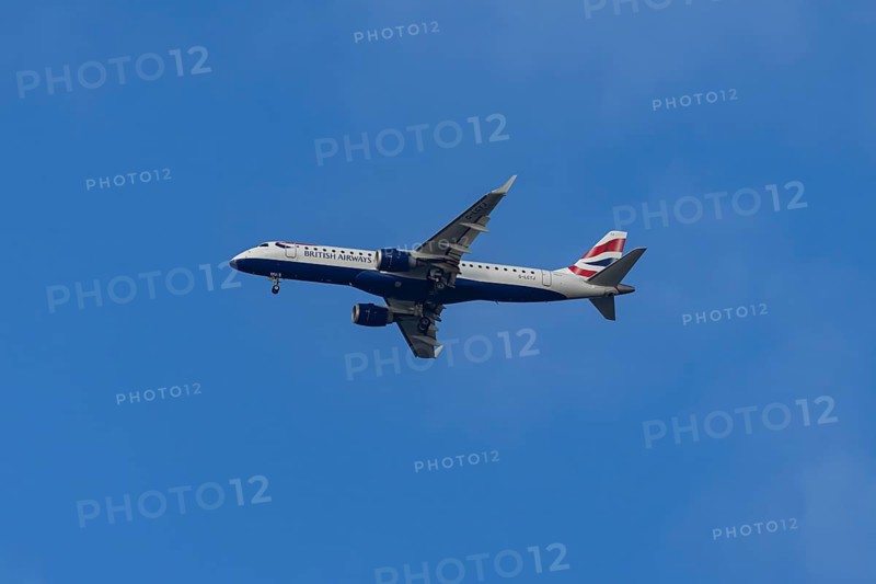 Embraer ERJ-190 jet passenger aircraft of British Airways BA CityFlyer airlines in flight on approach to London city airport, England, United Kingdom
