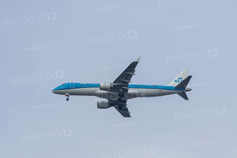 Embraer ERJ-190 jet passenger aircraft of Royal Dutch KLM cityhopper airlines in flight on approach to London city airport, England, United Kingdom