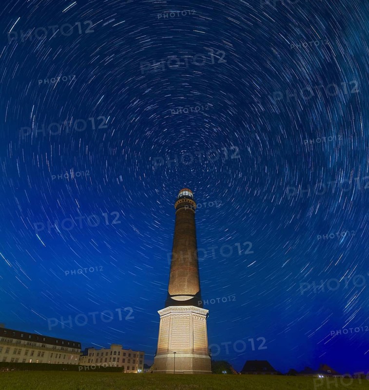 Starry sky above Borkum lighthouse Germany