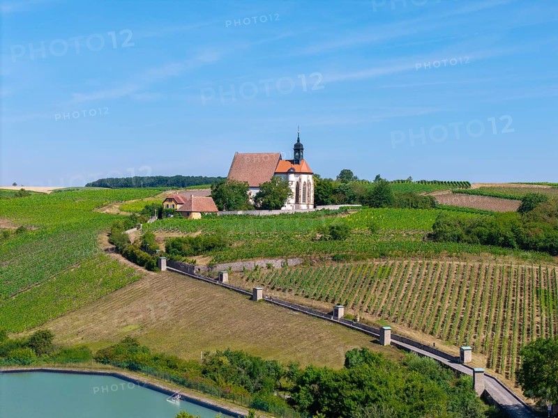 Pilgrimage church Maria im Weingarten, in a hilly, green landscape with blue sky, aerial view, near Volkach am Main, Lower Franconia, Mainfranken, Bavaria, Germany