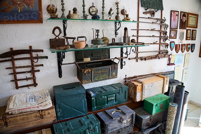 Shelves with antique weapons, lamps and crates in a military museum, war museum, military museum, private military museum, Platanos, Leros, WW2, Dodecanese, Greek Islands, Greece