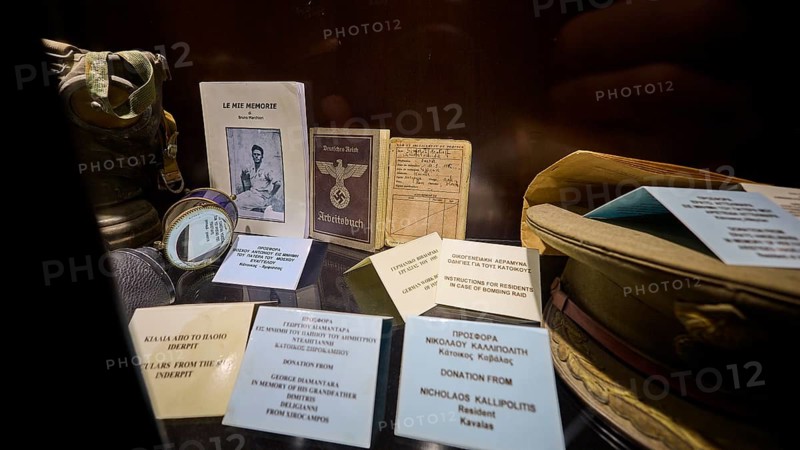 Display case with historical documents and memorabilia, including a book and pictures, workbook, war museum, military museum, tunnel museum, Lakki, Leros, WW2, Dodecanese, Greek Islands, Greece