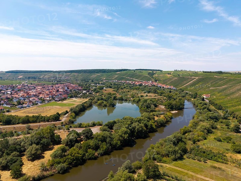 Wide river meandering through a green landscape with a village on the banks, Nordheim am Main, Mainfranken, Mainschleife, Franconia, Lower Franconia, Bavaria, Germany