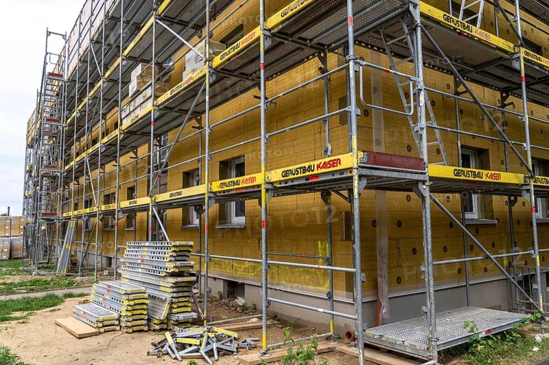 Energy refurbishment of an older residential building, thermal insulation with mineral wool insulation boards, mounted on the façade and then plastered, North Rhine-Westphalia, Germany